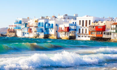 Discovering Mykonos: A Guide to the Island's Top Attractions - Iconic Mykonos Windmills Against Blue Sky - Mykonos Lighthouse Overlooking the Aegean Sea