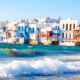 Discovering Mykonos: A Guide to the Island's Top Attractions - Iconic Mykonos Windmills Against Blue Sky - Mykonos Lighthouse Overlooking the Aegean Sea